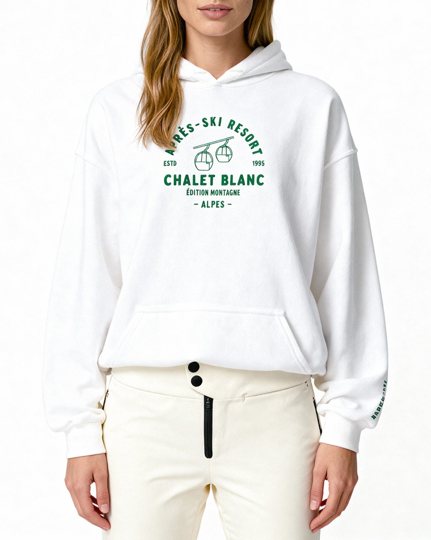 White hoodie with green text and graphics worn by a person on a white background
