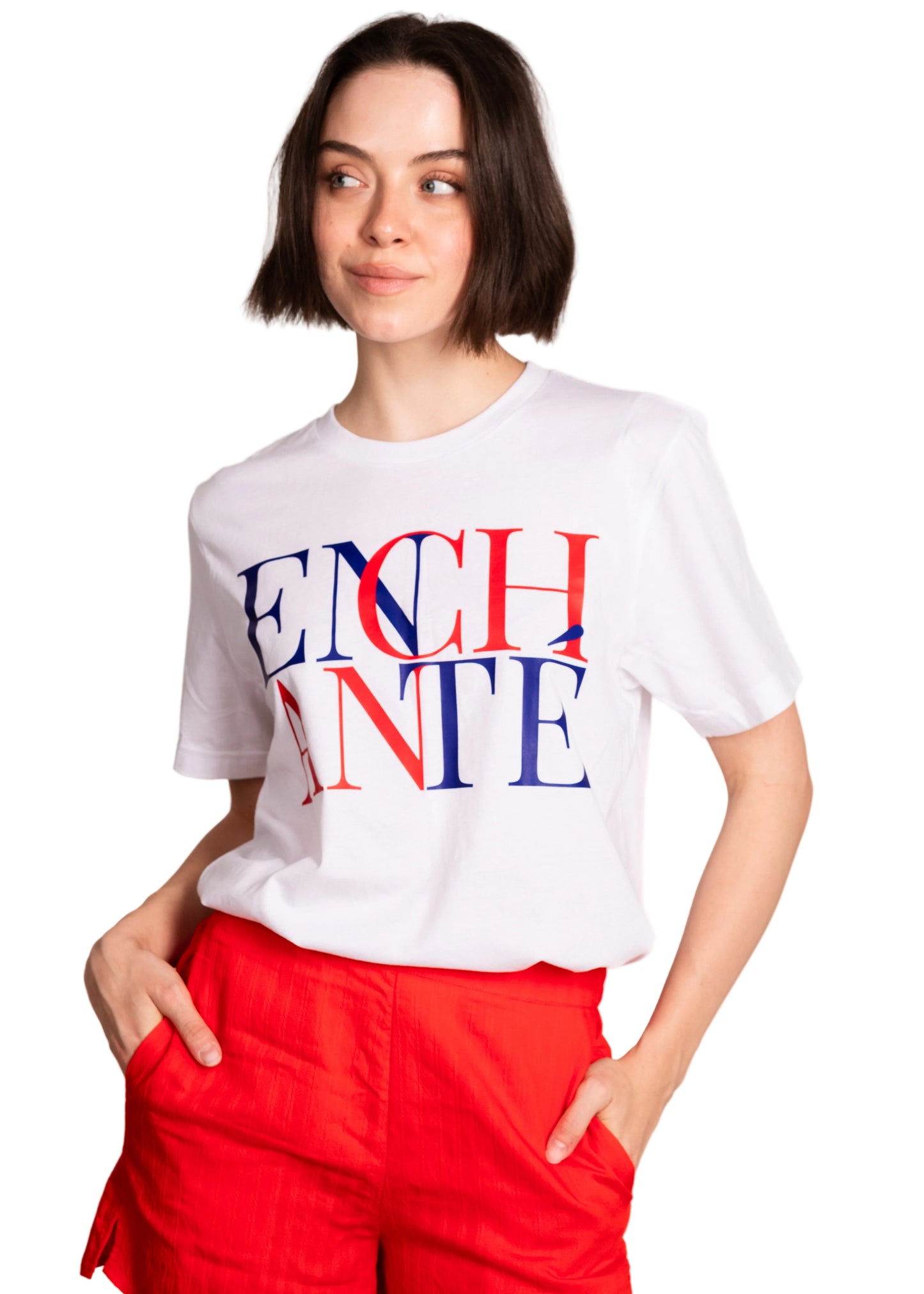 Person wearing a white t-shirt with colorful text on a plain background